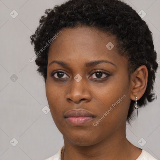 Neutral black young-adult female with short  brown hair and brown eyes