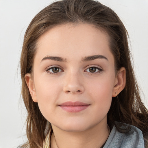 Joyful white child female with long  brown hair and brown eyes