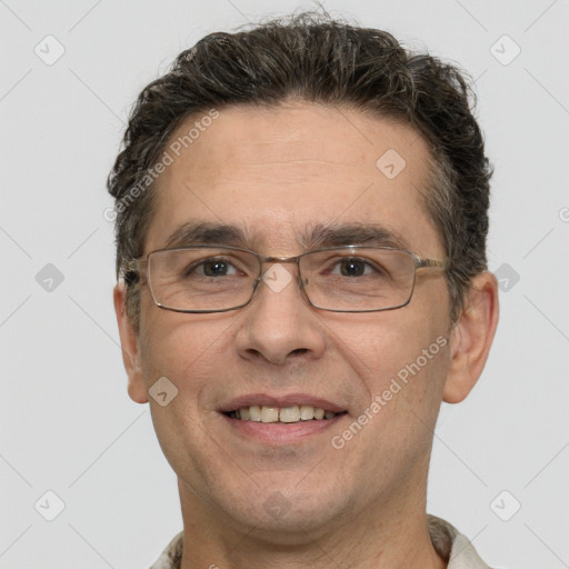 Joyful white adult male with short  brown hair and brown eyes