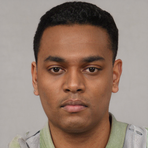 Neutral latino young-adult male with short  black hair and brown eyes