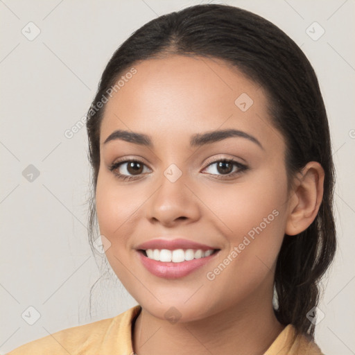 Joyful white young-adult female with long  brown hair and brown eyes