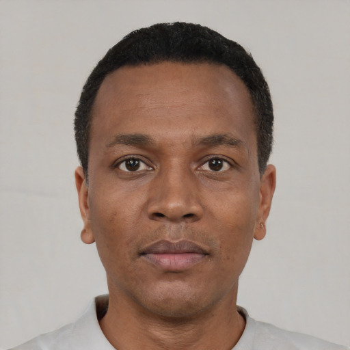 Neutral black young-adult male with short  black hair and brown eyes