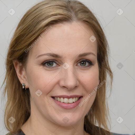 Joyful white adult female with medium  brown hair and grey eyes