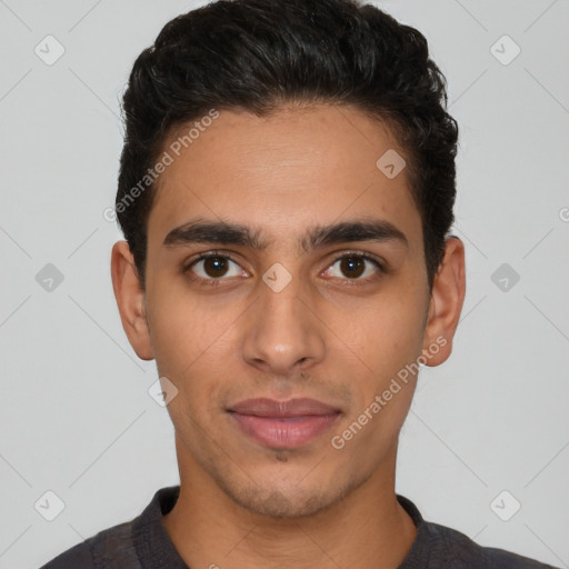 Joyful latino young-adult male with short  black hair and brown eyes