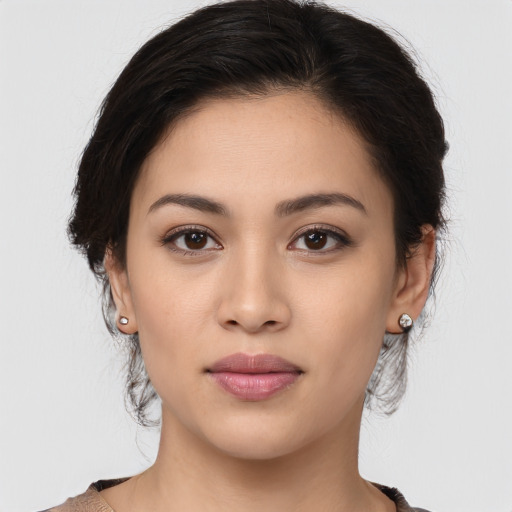 Joyful white young-adult female with medium  brown hair and brown eyes