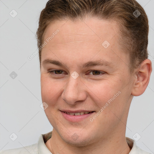 Joyful white young-adult male with short  brown hair and brown eyes