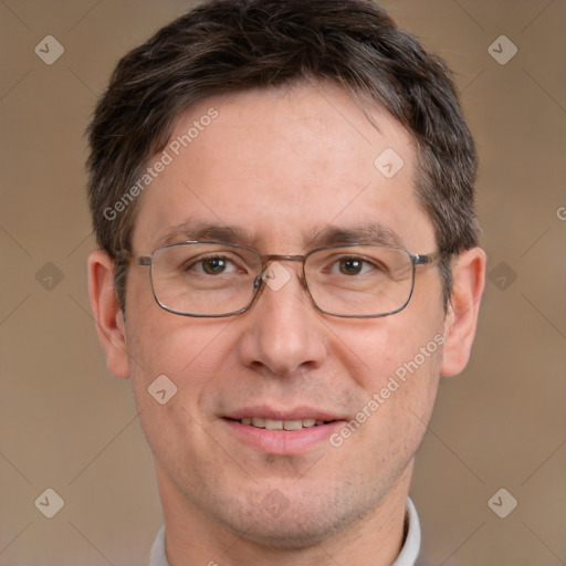 Joyful white adult male with short  brown hair and brown eyes