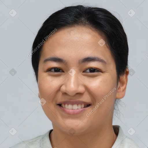 Joyful latino young-adult female with short  brown hair and brown eyes