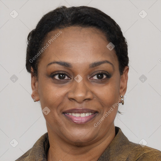 Joyful black adult female with short  brown hair and brown eyes