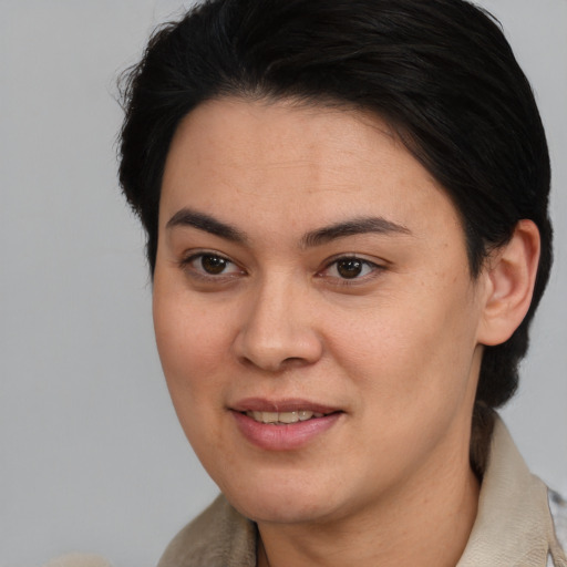 Joyful asian young-adult female with medium  brown hair and brown eyes