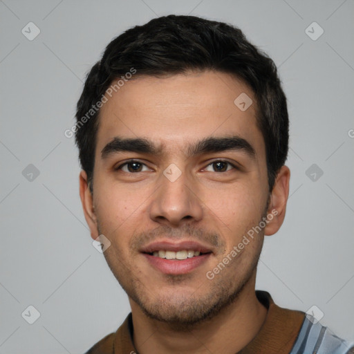 Joyful white young-adult male with short  black hair and brown eyes