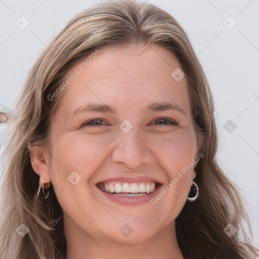 Joyful white young-adult female with long  brown hair and blue eyes