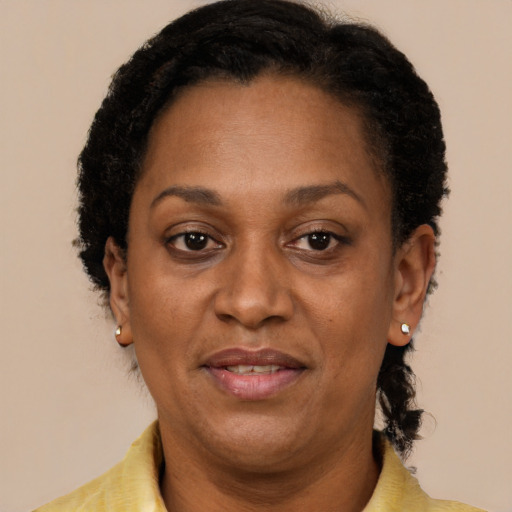 Joyful latino adult female with short  brown hair and brown eyes