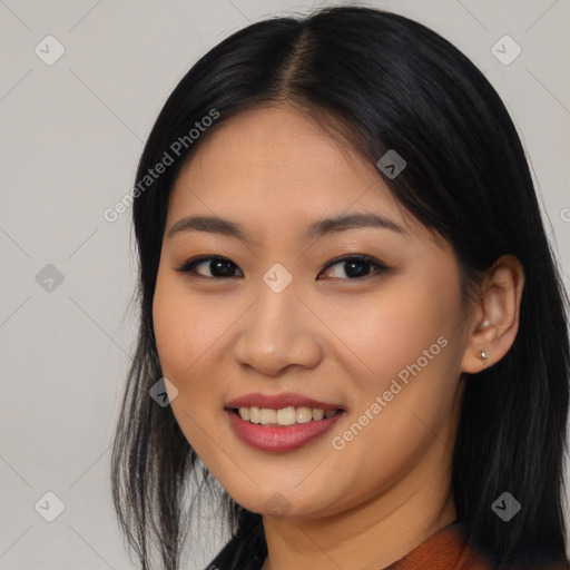 Joyful asian young-adult female with long  black hair and brown eyes