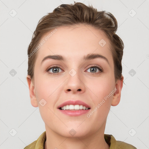 Joyful white young-adult female with short  brown hair and grey eyes