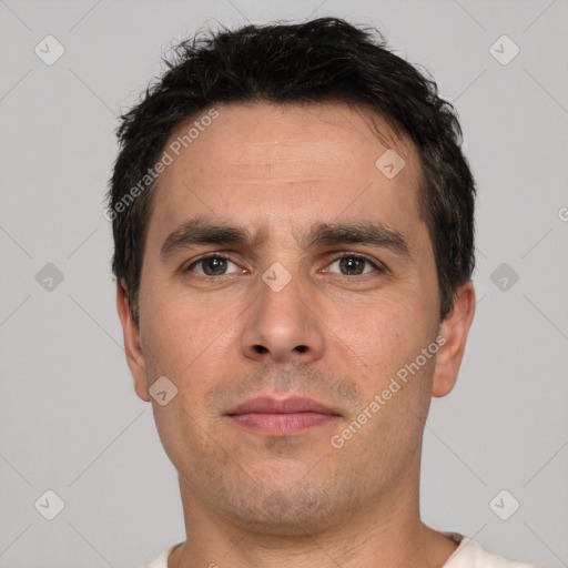 Neutral white adult male with short  black hair and brown eyes