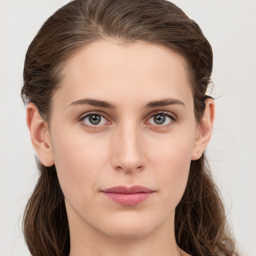 Neutral white young-adult female with long  brown hair and brown eyes