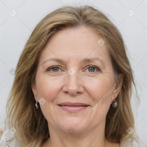 Joyful white adult female with long  brown hair and grey eyes