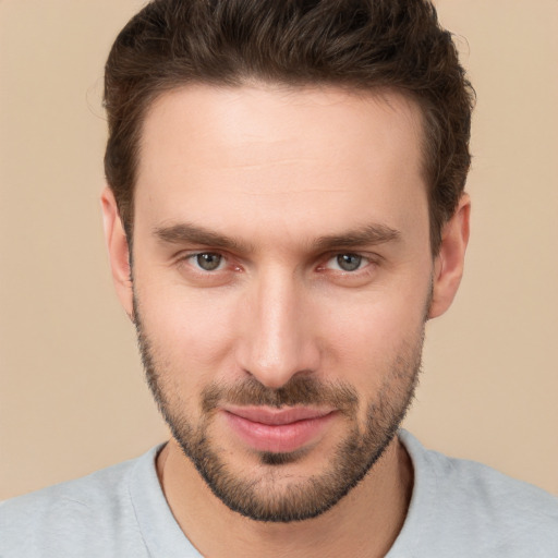 Joyful white young-adult male with short  brown hair and brown eyes