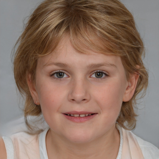 Joyful white child female with medium  brown hair and blue eyes