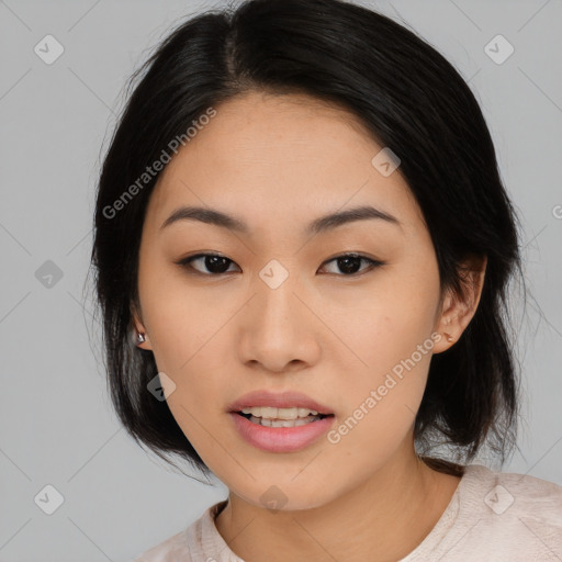 Joyful asian young-adult female with medium  black hair and brown eyes