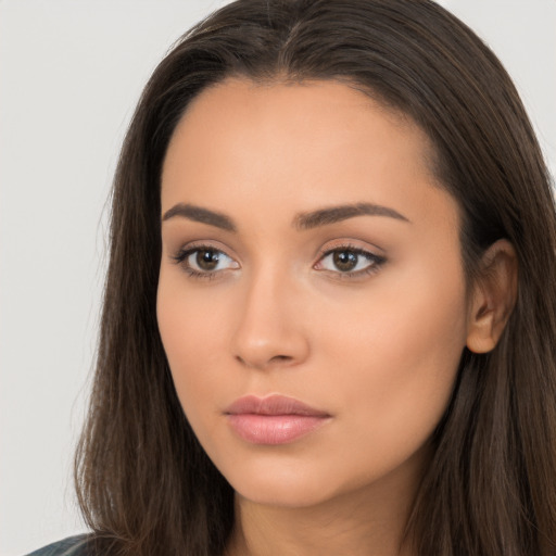 Neutral white young-adult female with long  brown hair and brown eyes