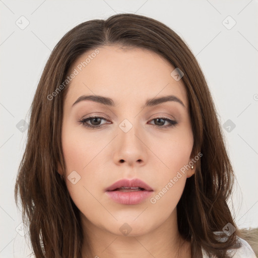 Neutral white young-adult female with long  brown hair and brown eyes