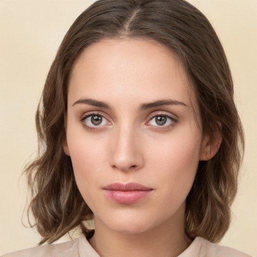 Neutral white young-adult female with medium  brown hair and brown eyes