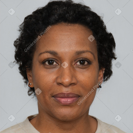 Joyful black adult female with short  brown hair and brown eyes