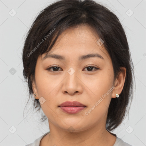 Joyful asian young-adult female with medium  brown hair and brown eyes