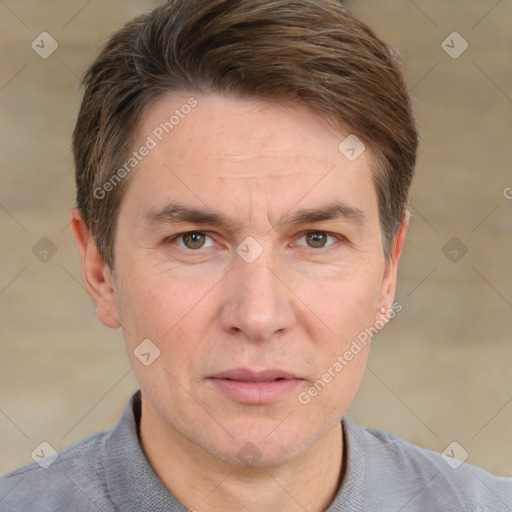 Joyful white adult male with short  brown hair and grey eyes