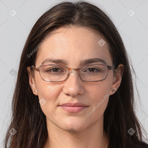 Joyful white adult female with long  brown hair and brown eyes