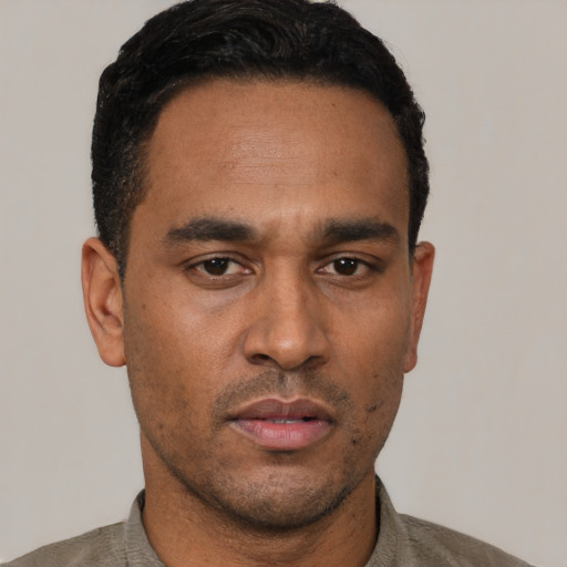 Neutral latino adult male with short  black hair and brown eyes