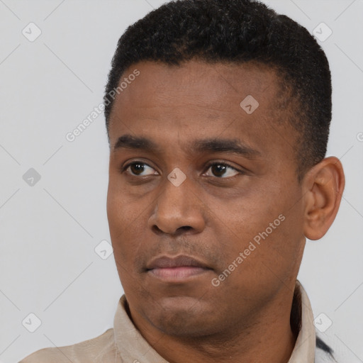 Neutral black young-adult male with short  black hair and brown eyes
