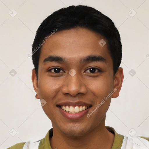 Joyful latino young-adult male with short  black hair and brown eyes