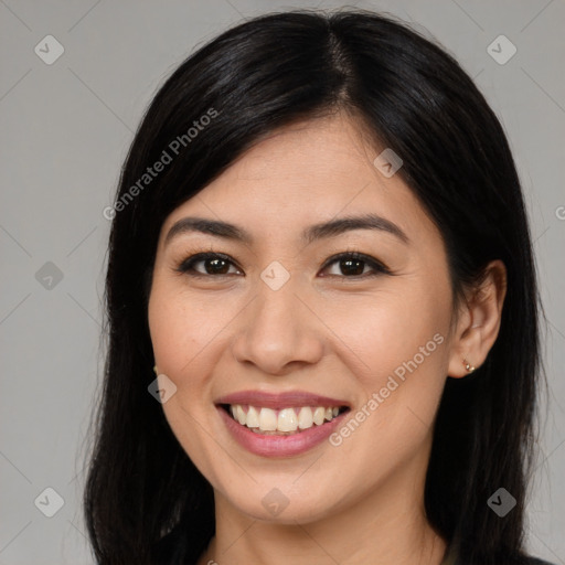 Joyful asian young-adult female with long  brown hair and brown eyes