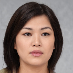 Neutral asian young-adult female with medium  brown hair and brown eyes