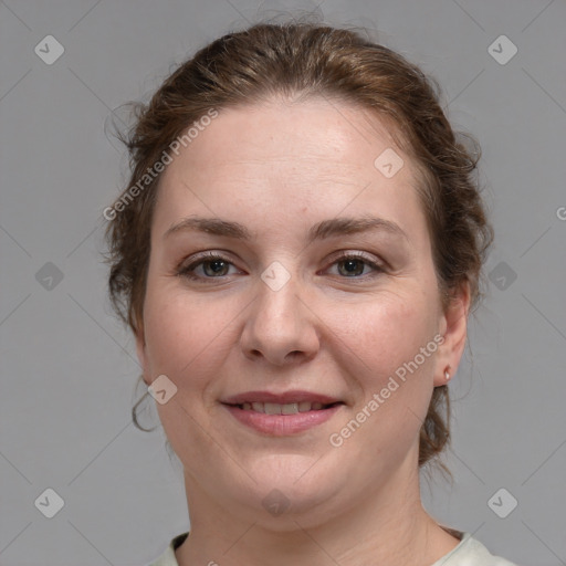 Joyful white young-adult female with medium  brown hair and blue eyes