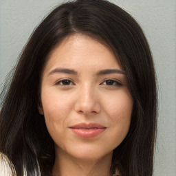 Joyful asian young-adult female with long  brown hair and brown eyes