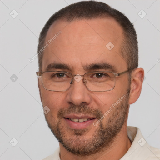 Joyful white adult male with short  brown hair and brown eyes