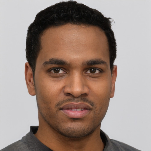 Neutral black young-adult male with short  black hair and brown eyes