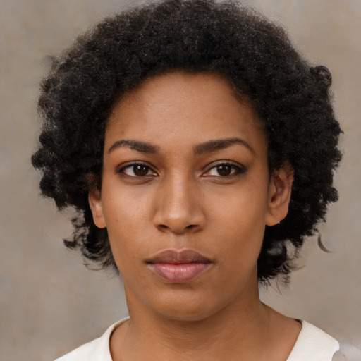 Neutral black young-adult female with short  black hair and brown eyes