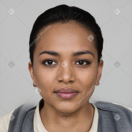 Joyful latino young-adult female with short  black hair and brown eyes