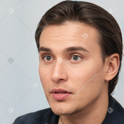 Neutral white young-adult male with short  brown hair and brown eyes