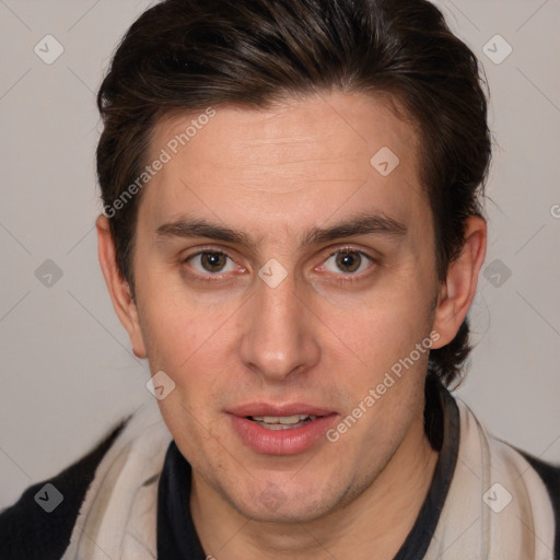 Joyful white adult male with short  brown hair and brown eyes