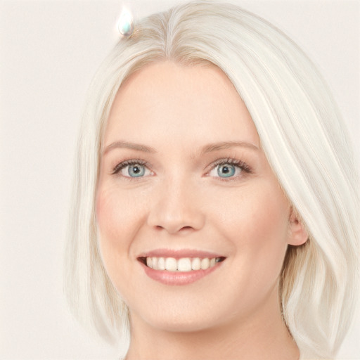 Joyful white young-adult female with long  blond hair and blue eyes