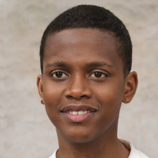 Joyful black young-adult male with short  brown hair and brown eyes