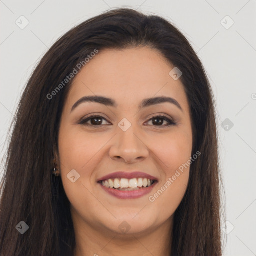 Joyful latino young-adult female with long  brown hair and brown eyes