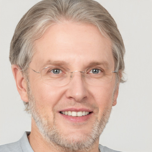 Joyful white middle-aged male with short  brown hair and grey eyes