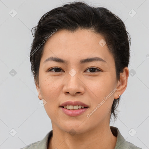 Joyful asian young-adult female with short  brown hair and brown eyes